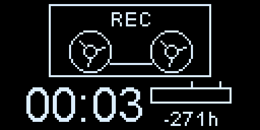 The recorder while recording: REC at the top of the cassette, the timer at 00:03 and the time left counting down