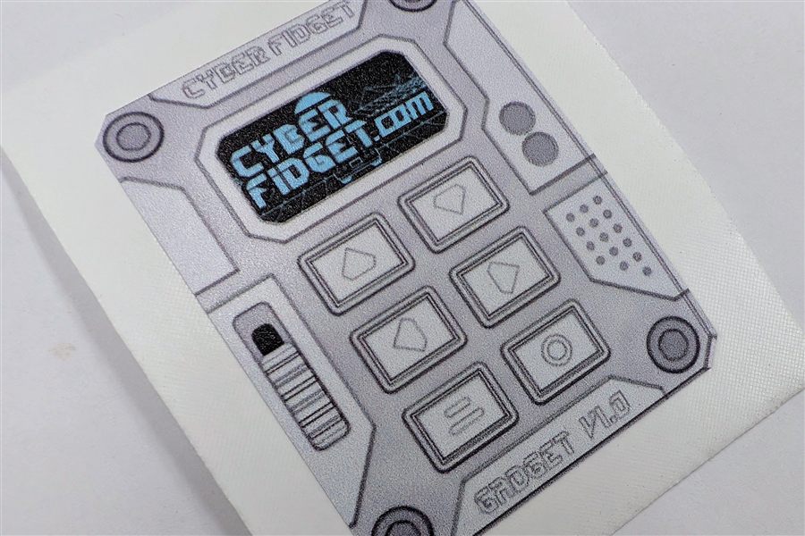 A Cyber Fidget sticker: a drawing of the device's face with cyberfidget.com on its screen